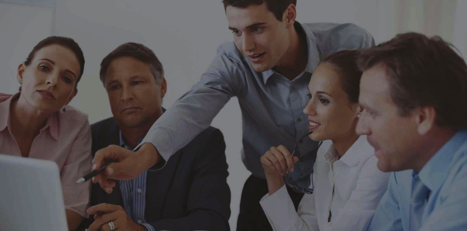 Financial team reviewing association reports together
