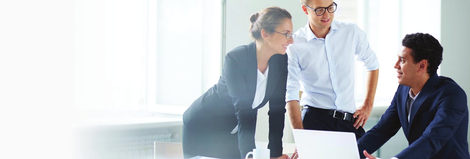 TPG community management professionals collaborating at a laptop